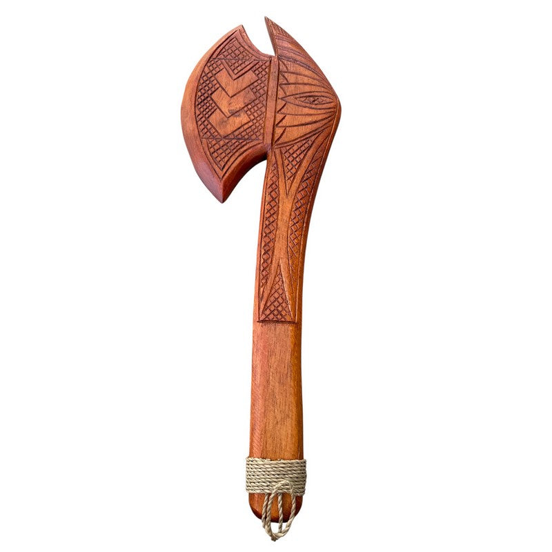 Wooden axe with intricate carvings on a white background
