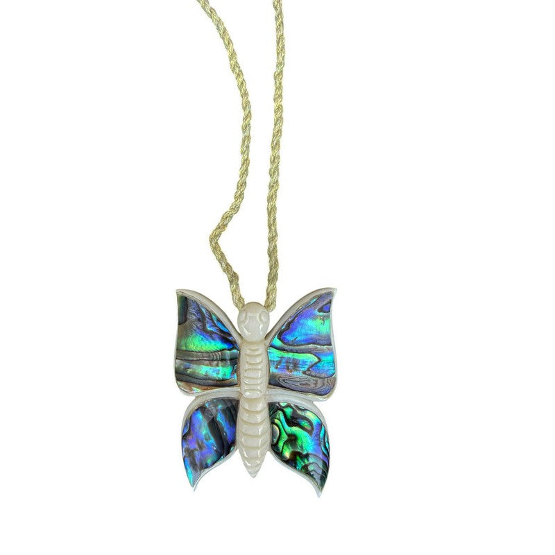 Butterfly-shaped pendant with colorful wings on a gold chain against a white background