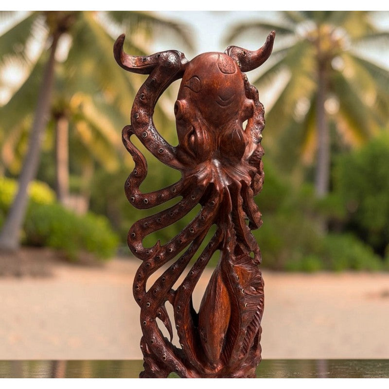 A carved wooden octopus figurine with a rich reddish-brown finish, set against a blurred tropical background of palm trees and sand.