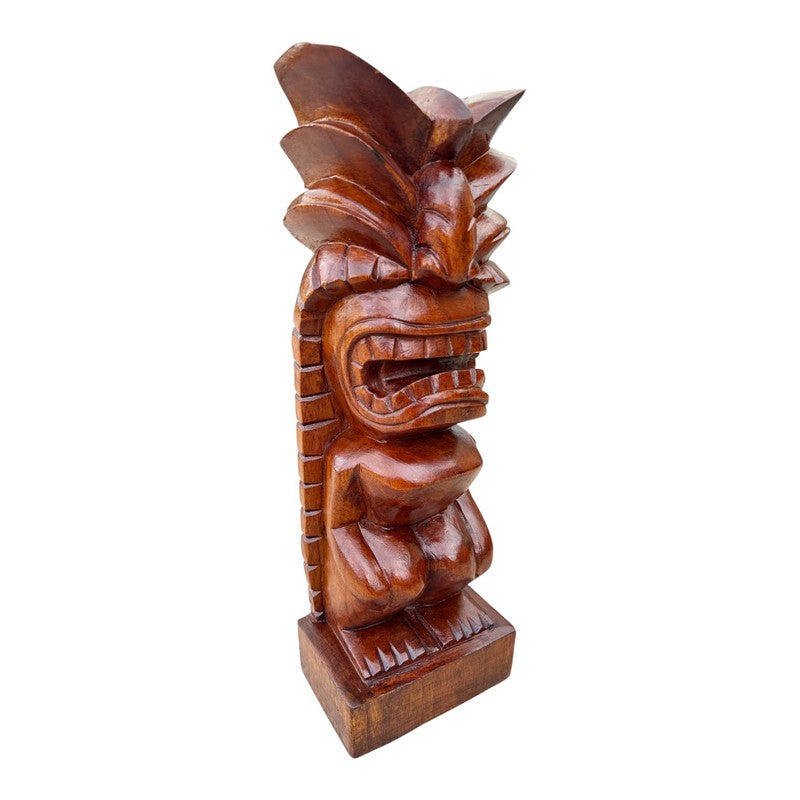 Wooden tiki mask sculpture on a white background