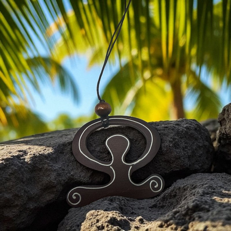 Decorative pendant on a rock with palm trees in the background