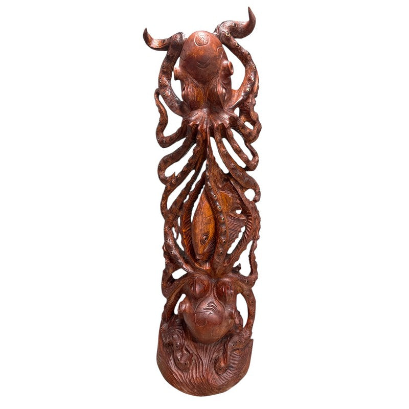 Wooden carvings of octopus and fish on a white background