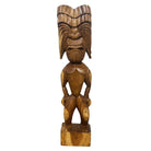 Wooden tiki statue with detailed carvings on a white background