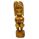 Wooden tiki statue on a white background