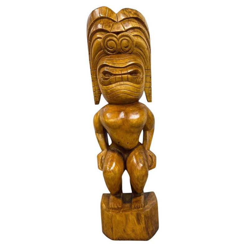 Wooden tiki statue on a white background