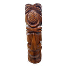 Wooden tiki statue with pineapple design on a white background